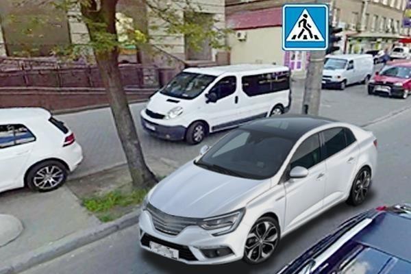 Малюнок до питання 94: Чи дозволено водієві сірого автомобіля зупинитись у цьому місці?